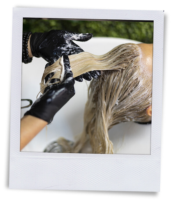 polaroid toning hair at the shampoo bowl