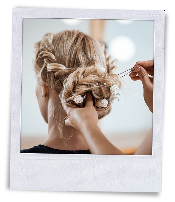 polaroid pinning formal updo to womans hair